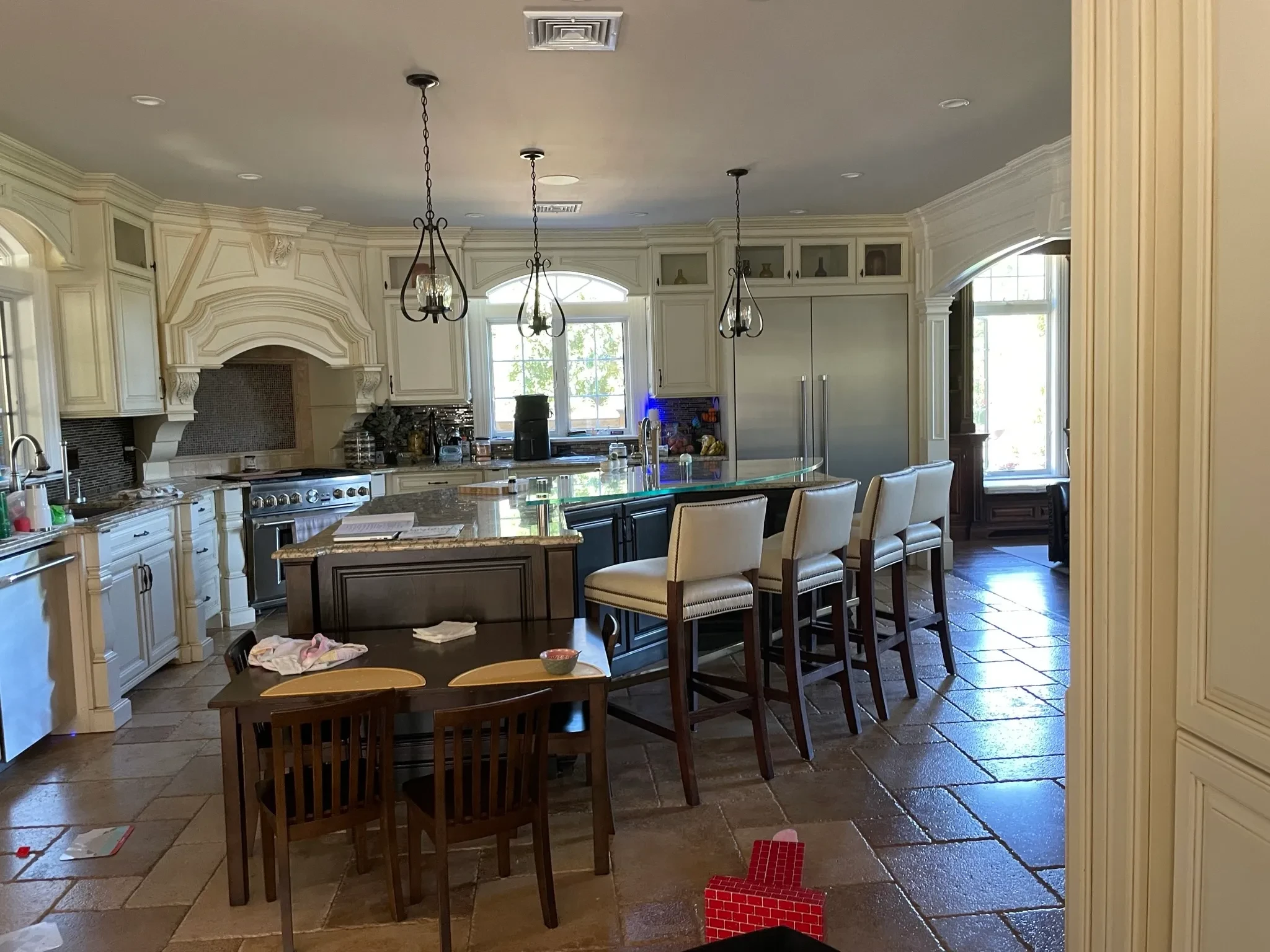 Grand kitchen with custom cabinetry and island