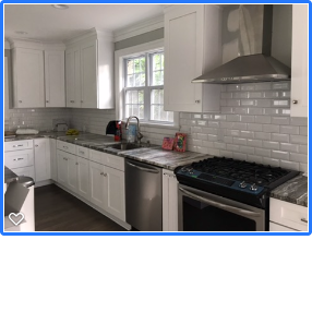 Custom kitchen remodel with white cabinetry and stone countertops